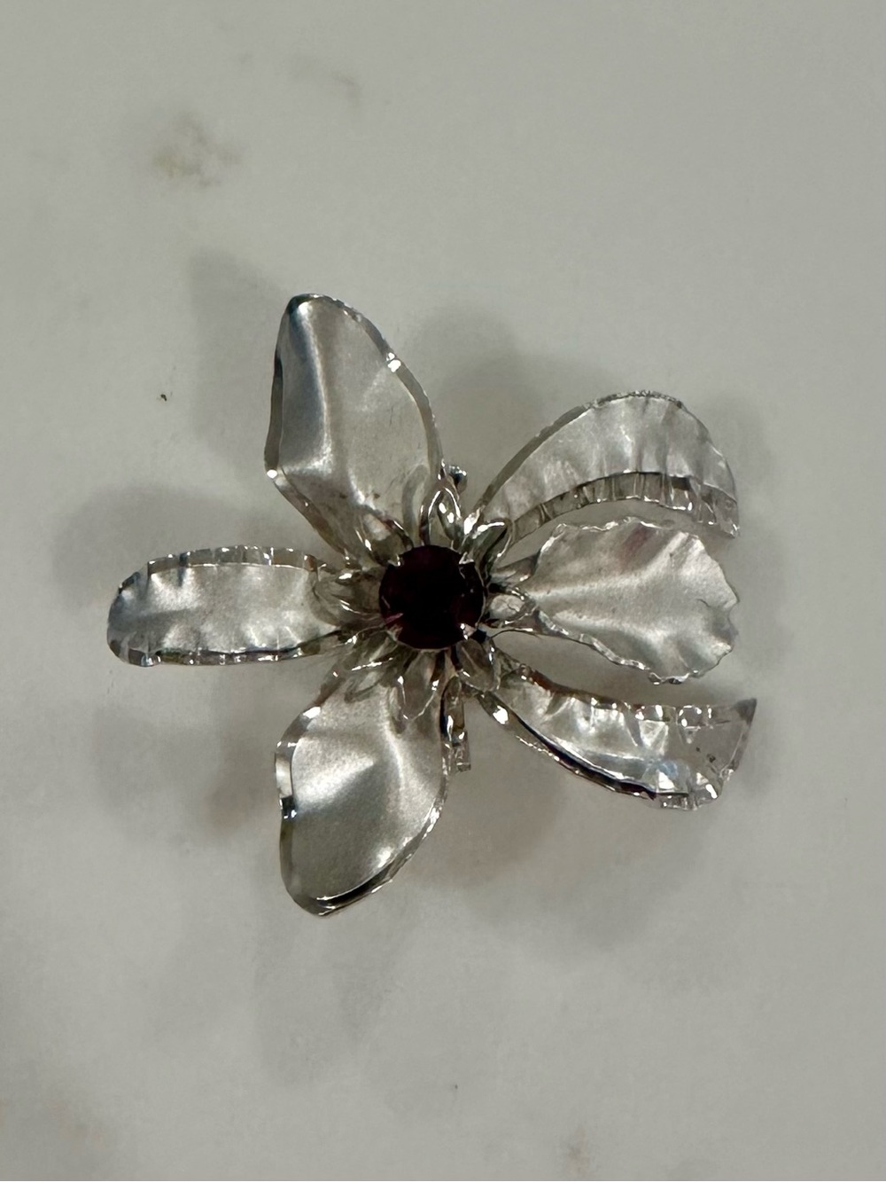 Silver Flower Brooch with Dark Purple Stone